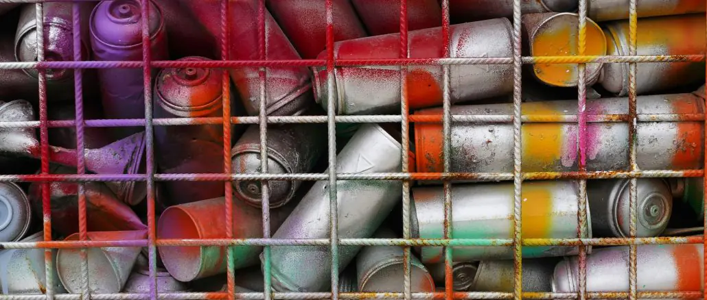 Rattle cans in a bin