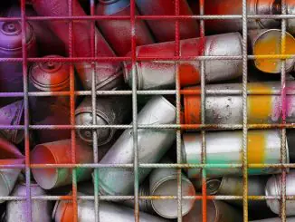 Rattle cans in a bin